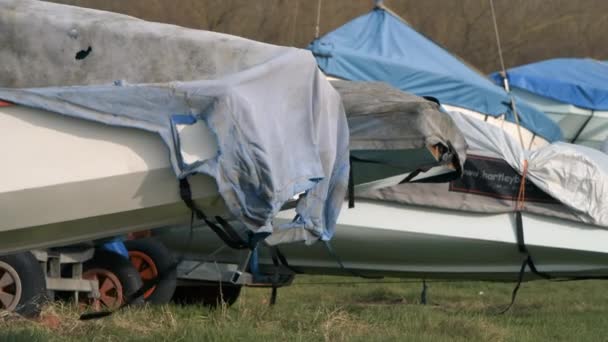 Hornsea, UK - 26th January 2020: Rowing boats under cover during the winter months in very windy weather, Hornsea, UK — Stok video