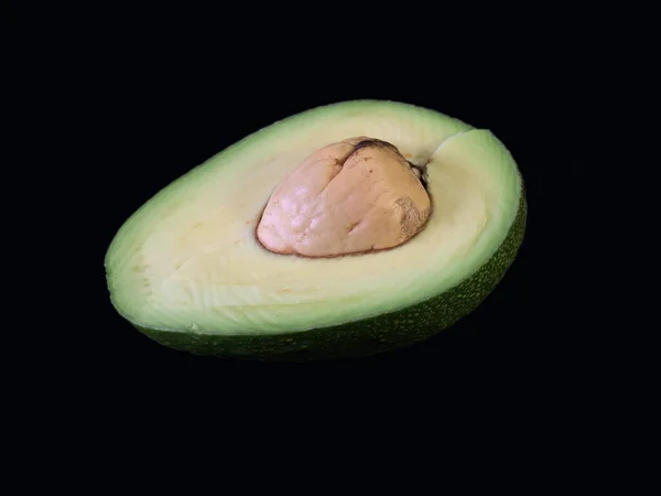 Slice Green Avocado Isolated Black Background Ripe Avocado Bone Cut — Stock Photo, Image