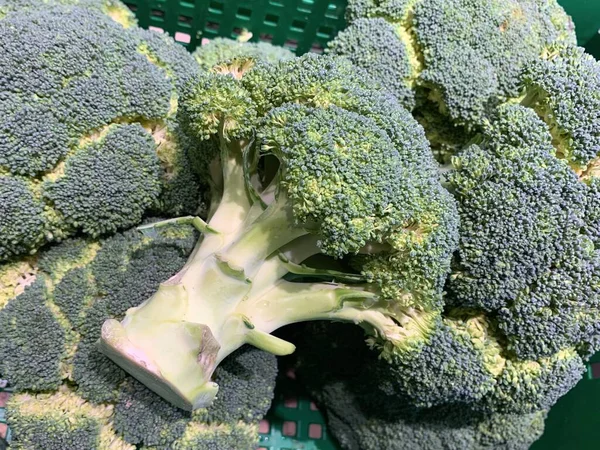 Background texture: Green cauliflower. Green broccoli in a shop window, closeup. Concept: vegetarianism, vegetable diet, healthy eating.