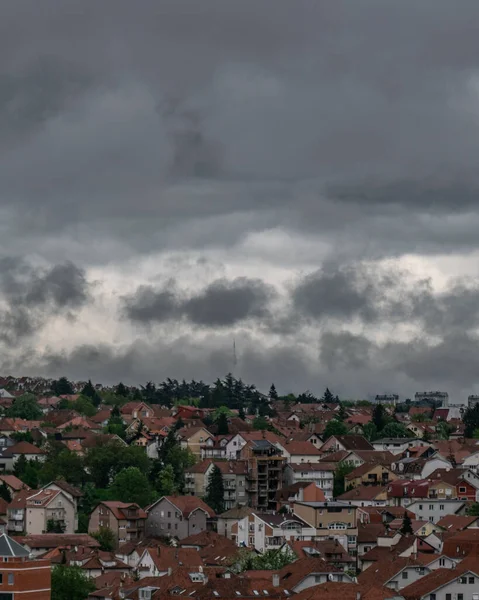 Dark clouds over urban area