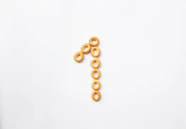 Number 1 made from food on a white background. Figures from bagels. Space for text — 스톡 사진