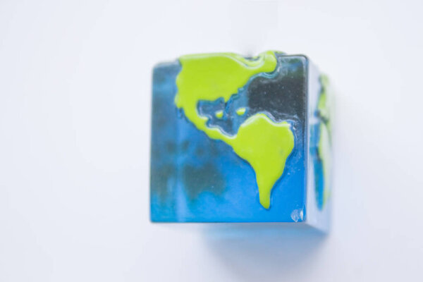  Square globe, planet earth on a white background. Earth Day, Top view, flatlay.