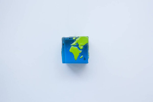 earth square globe on white background. Mock up. Flat lay composition.