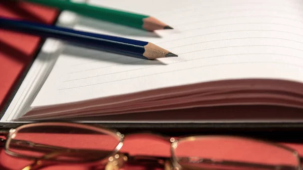 Couple Pencils Notebook Glasses Red Table Home — Stock Photo, Image