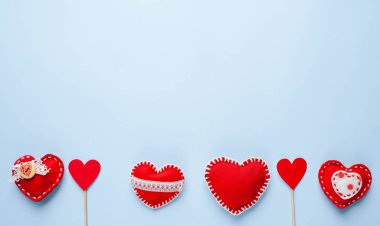 Valentine's day background. Various hearts on a blue background. Valentine's day concept.