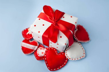 Valentine's day background. Gift, different hearts on a blue background. Valentine's day concept. 