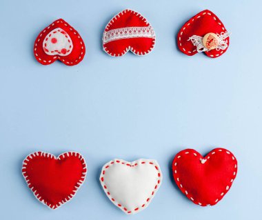 Valentine's day background. Various hearts on a blue background. Valentine's day concept.