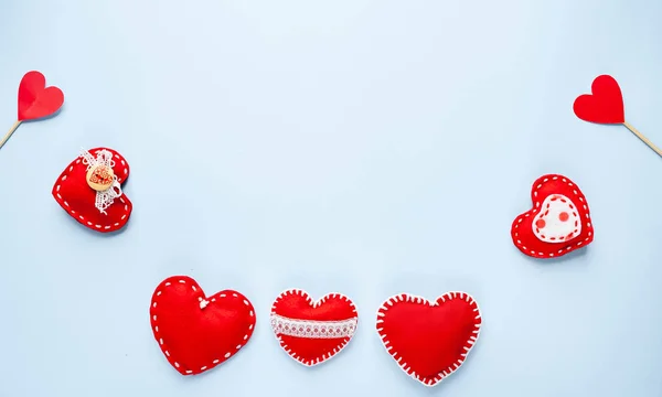 Valentine's day background. Various hearts on a blue background. Valentine's day concept.