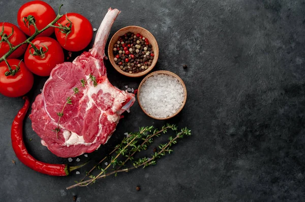 Raw Beef Steak Beef Tomahawk Spices Thyme Stone Background — Stockfoto