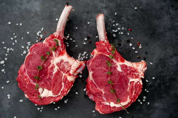 Two Raw Steaks Beef Tomahawk Spices Thyme Stone Background — Stock Photo, Image