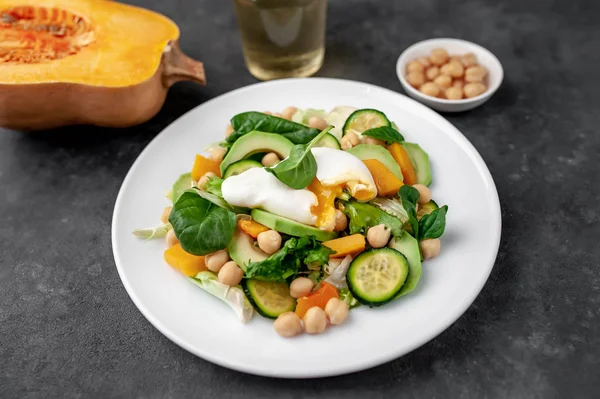 Plate Avocado Salad Chickpeas Pumpkins Cucumbers Poached Eggs Plate Stone — Stok fotoğraf