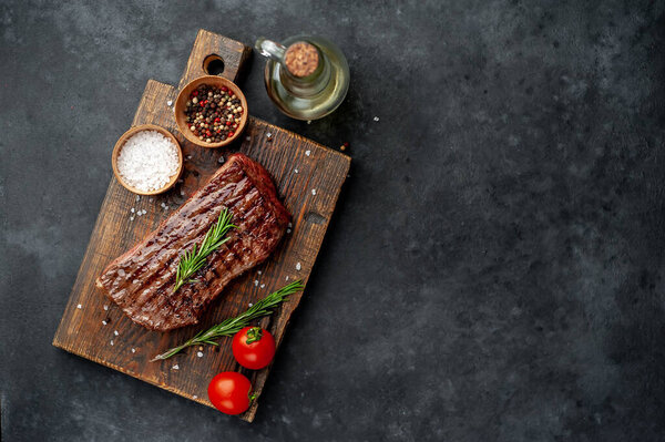 grilled beef steak on a stone background