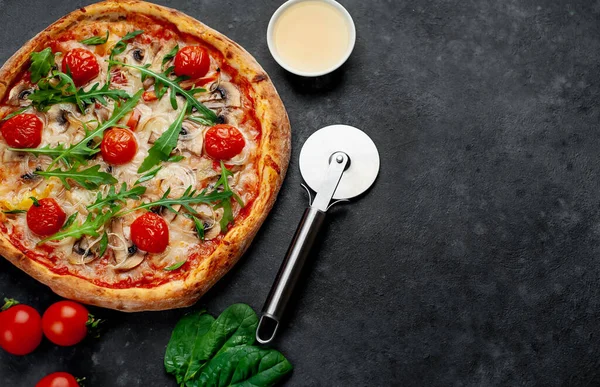 Delicious italian pizza with mozzarella cheese, mushrooms, tomato, bell pepper