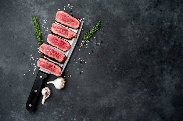 grilled beef steak on a stone background