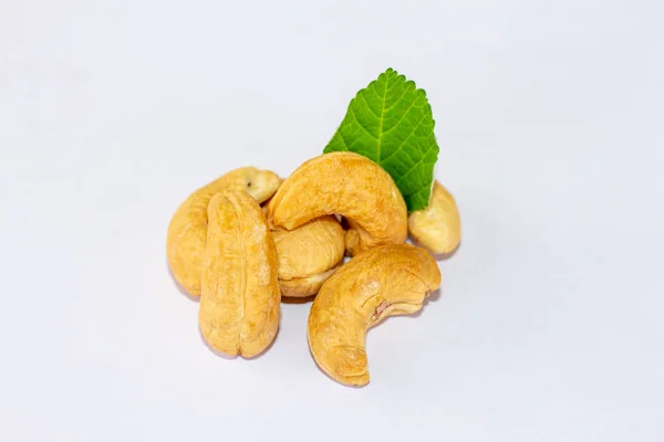 Roasted Cashew Nuts Green Leaves Isolated White Background Macro Studio — Stock Photo, Image