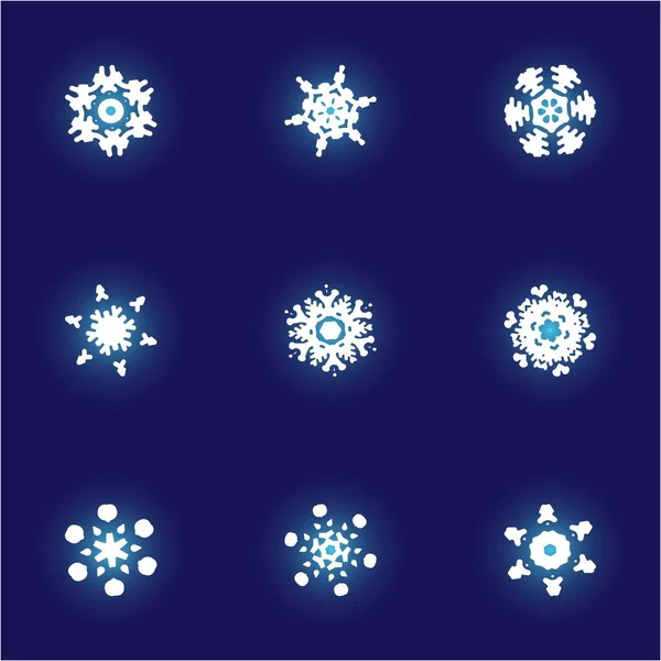 Conjunto de copos de nieve recortados navidad sobre fondo azul . — Foto de Stock