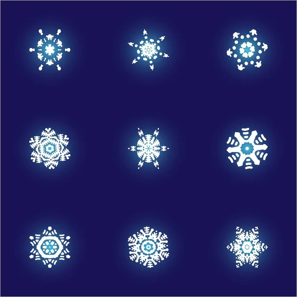 Kit de simples copos de nieve navideños sobre fondo azul . —  Fotos de Stock