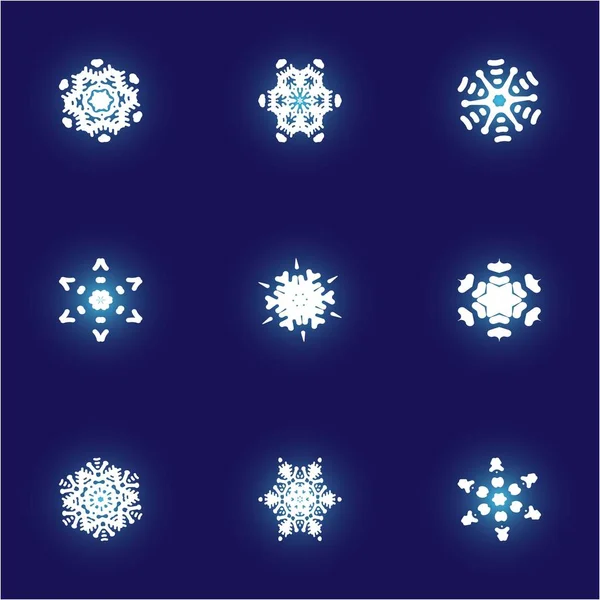 Kit de copos de nieve simples y hermosos sobre fondo azul . —  Fotos de Stock