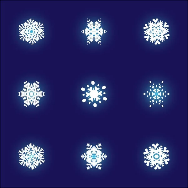 Conjunto de copos de nieve de papel navideño sobre fondo azul . — Foto de Stock