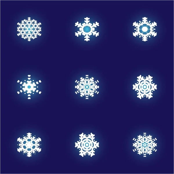 Colección de copos de nieve aislados cortados en papel sobre fondo azul . —  Fotos de Stock