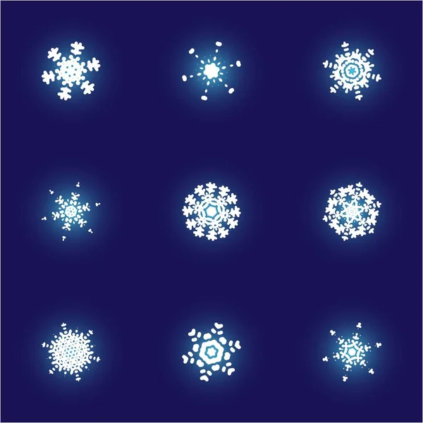 Conjunto de copos de nieve aislados sobre fondo azul . —  Fotos de Stock