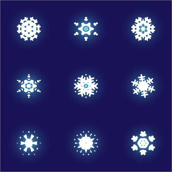 Набор изолированных падающих снежинок на голубом фоне . — стоковый вектор