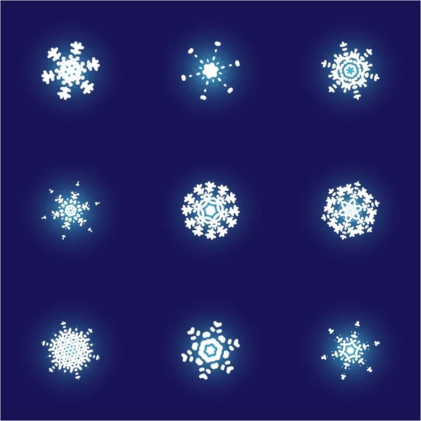Набір ізольованих падаючих сніжинок на синьому фоні . — стоковий вектор