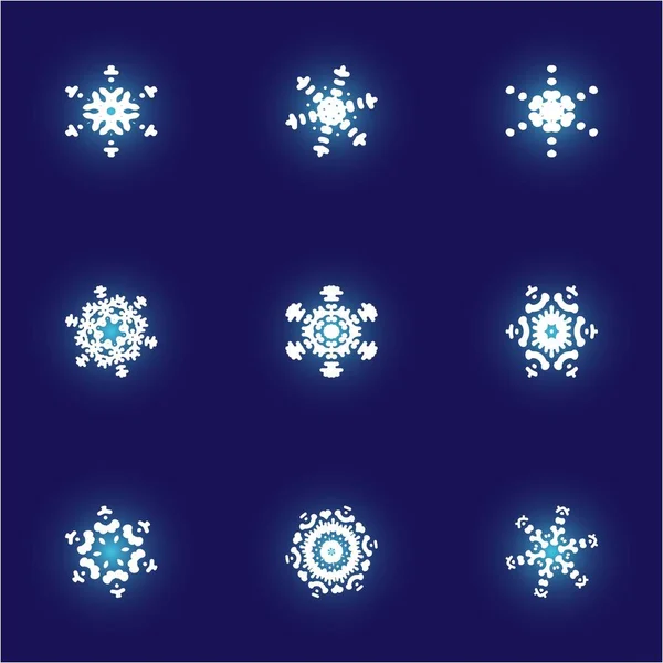 Conjunto de copos de nieve aislados sobre fondo azul . — Archivo Imágenes Vectoriales