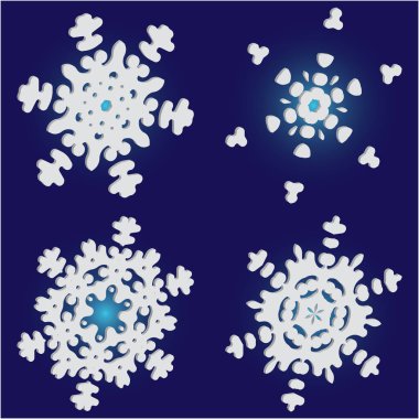 Mavi zemin üzerinde izole kar taneleri kesilmiş kağıt koleksiyonu. 