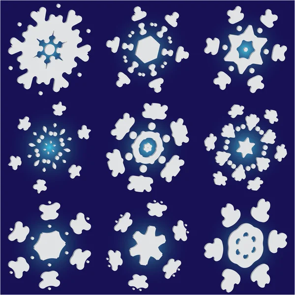 Kit de silhouettes isolées de flocons de neige sur fond bleu . — Image vectorielle