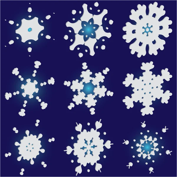 Колекція різання паперу ізольовані сніжинки на синьому фоні . — стоковий вектор