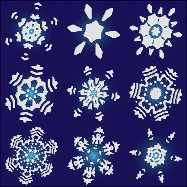 Conjunto de copos de nieve aislados sobre fondo azul . — Vector de stock