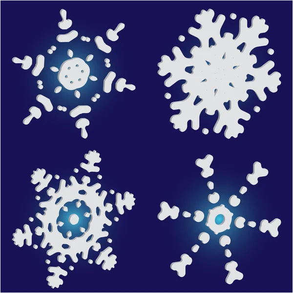 Ensemble de flocons de neige en papier de Noël sur fond bleu . — Image vectorielle