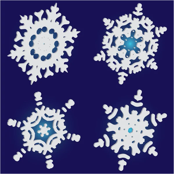 Mavi zemin üzerinde izole kar taneleri kesilmiş kağıt koleksiyonu. 
