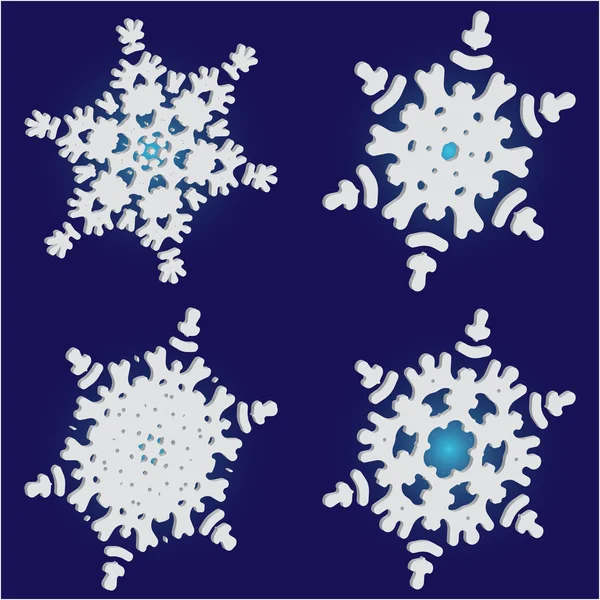 Collection de flocons de neige isolés coupés sur fond bleu . — Image vectorielle