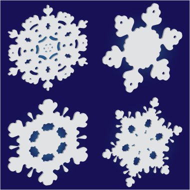 Mavi zemin üzerinde izole kar taneleri kesilmiş kağıt koleksiyonu. 