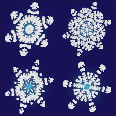 Mavi arkaplanda düşen izole kar taneleri kümesi. 