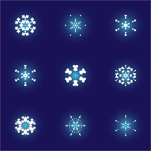 Conjunto de copos de nieve aislados sobre fondo azul . — Archivo Imágenes Vectoriales