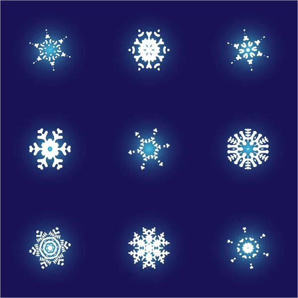 Conjunto de copos de nieve recortados navidad sobre fondo azul . — Archivo Imágenes Vectoriales