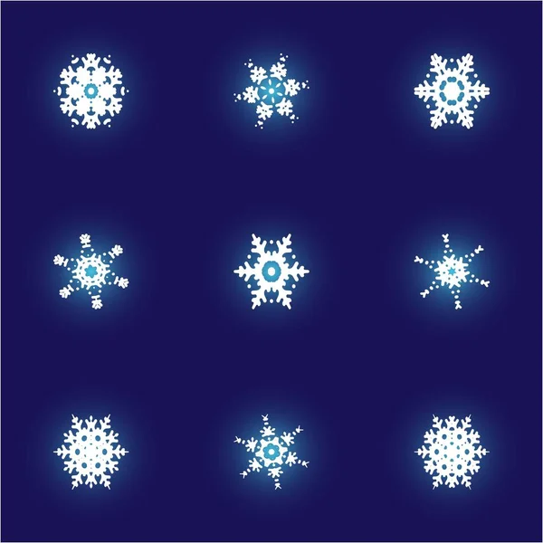 Conjunto de copos de nieve aislados sobre fondo azul . — Archivo Imágenes Vectoriales