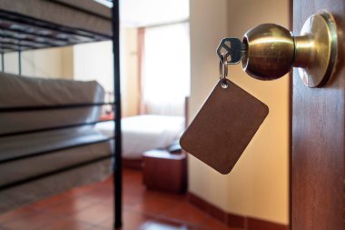 Hotel key with a key tag to place information inside