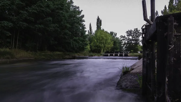 Stream of water flowing through irrigation — Stock Photo, Image