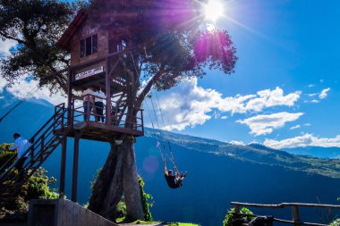 Tourist enjoying the tree house of the swing of the end of the world (Columpio del fin del mundo) clipart