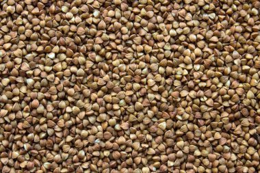 Kopyalama alanı olan tek tip bir arka plan. Karabuğday, yüzeyde düz bir tabakaya dağılmış..