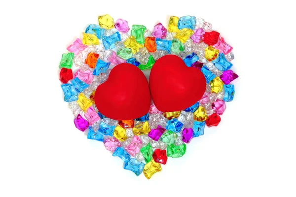 Heart shape made of colored transparent stones — Stock Photo, Image