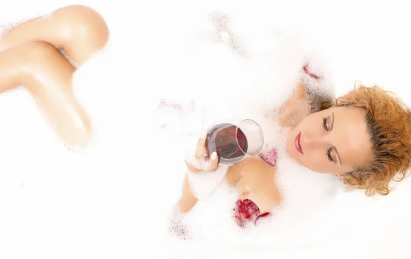 Spa Concepts. Sensual Alluring Sexy Caucasian Blond Female in Foamy Bathtub
