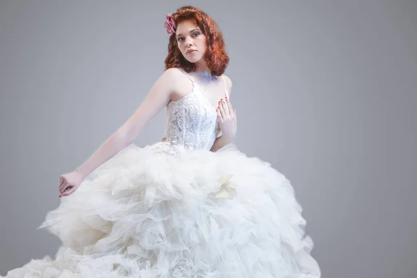 Wedding Ideas and Concepts. Young Caucasian Ginger Female Wearing Wedding Dress