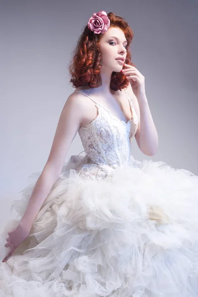 Wedding Concepts. Young Caucasian Red-Haired Female Wearing Tailored Dress