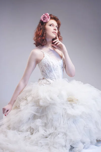 Wedding Ideas and Concepts. Young Caucasian Ginger Female Wearing White Wedding Dress