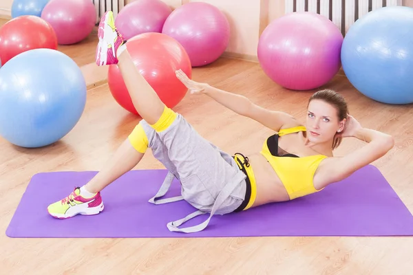 Sport, Fitness, Wellness and Lifestyle Concepts. Caucasian Sexy Female Athlete In Good Fit Posing With Barbell and Doing Leg Stretching Exercises in Gym.Horizontal Image Orientation